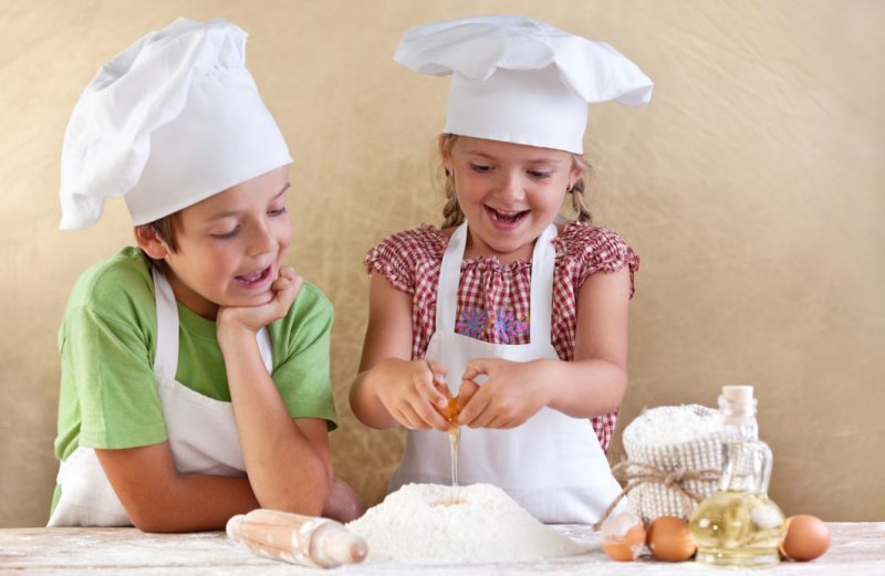 Aspiring Young Chefs with Apron and Caps